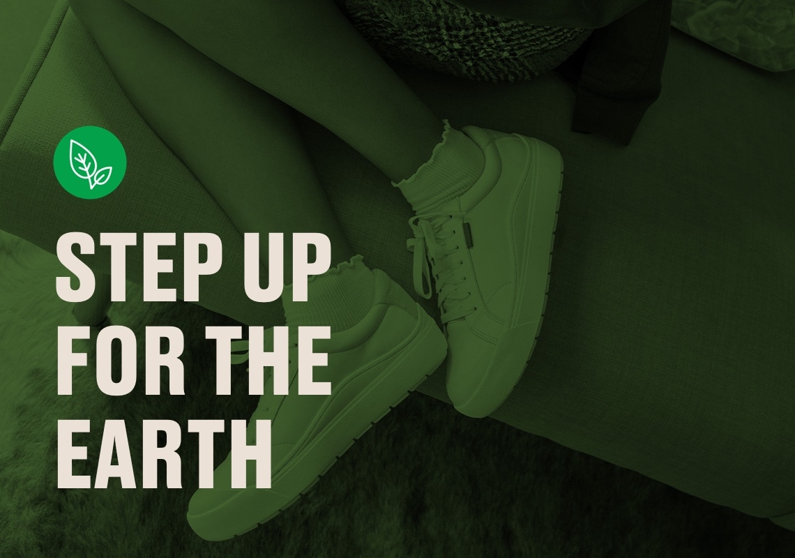 step up for the earth with feet of person wearing dr scholls time off sneakers in the background