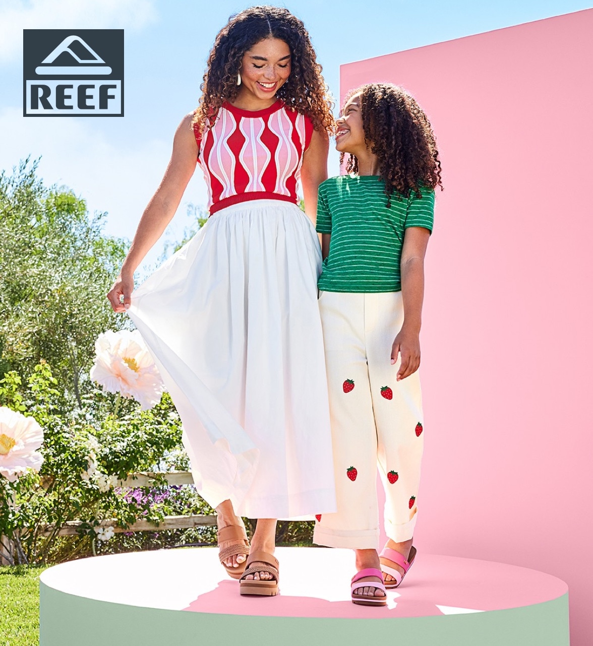 mother and daughter in spring outfits wearing reef sandals with reef logo in upper left corner