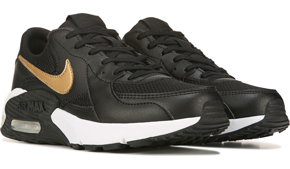 nike women black and gold